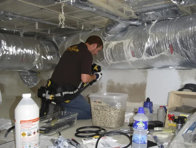 Medway Air Duct Cleaning specialist performing professional mold removal from air ducts in Medway