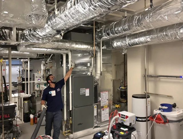 Medway Air Duct Cleaning specialist performing thorough furnace duct cleaning in a Medway residence