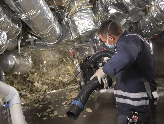 Medway Air Duct Cleaning specialist operating negative pressure cleaning equipment for thorough duct maintenance in Medway